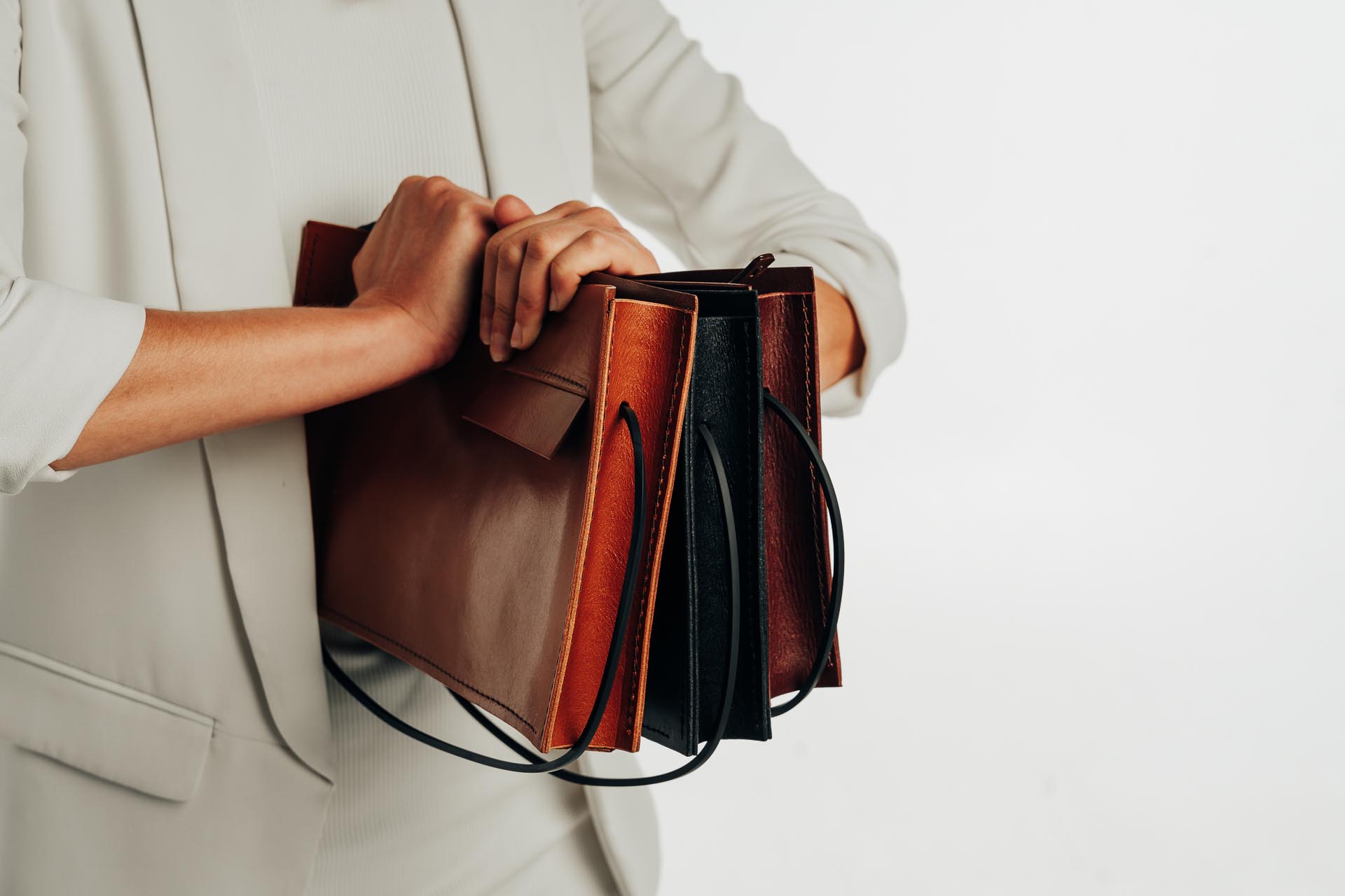 zoe wilmaers holding multiple bags